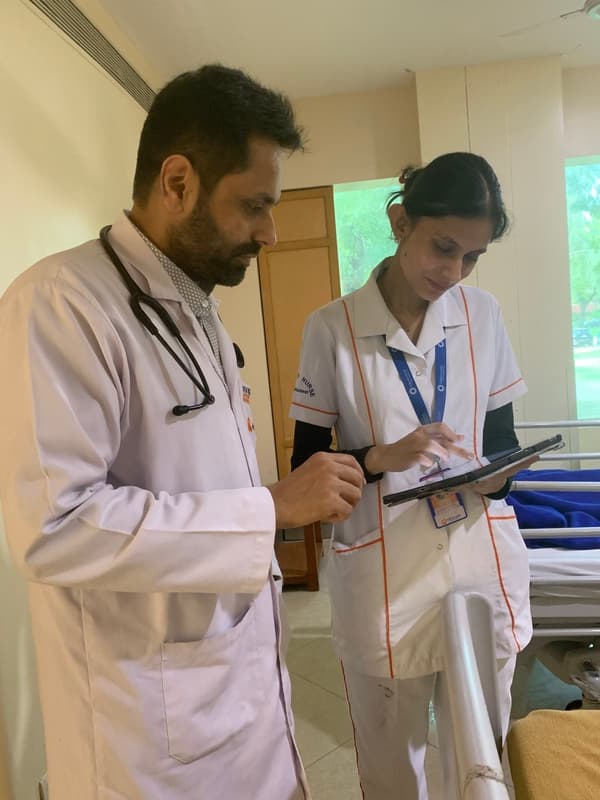 Dr. Kunal Luthra discussing care with his clinical team